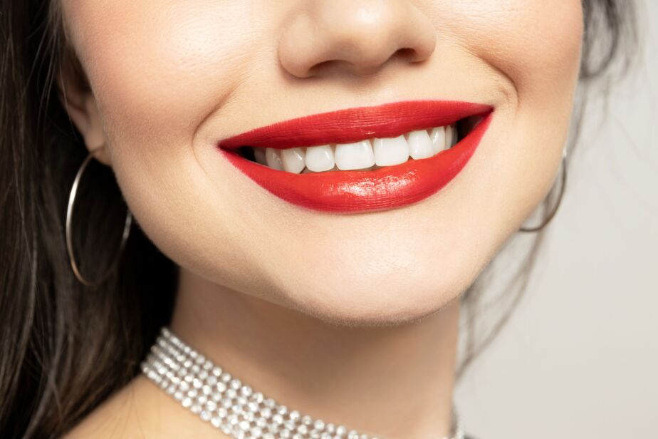 Hollywood smile close-up with bright white teeth and red lipstick