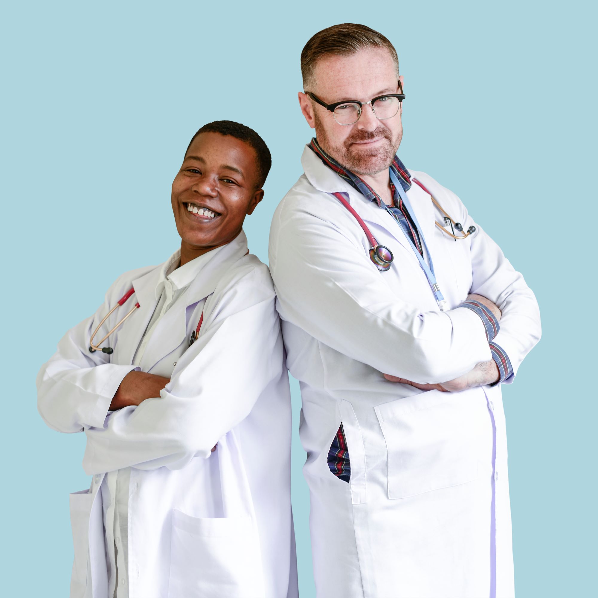 Dentists in white coats smiling