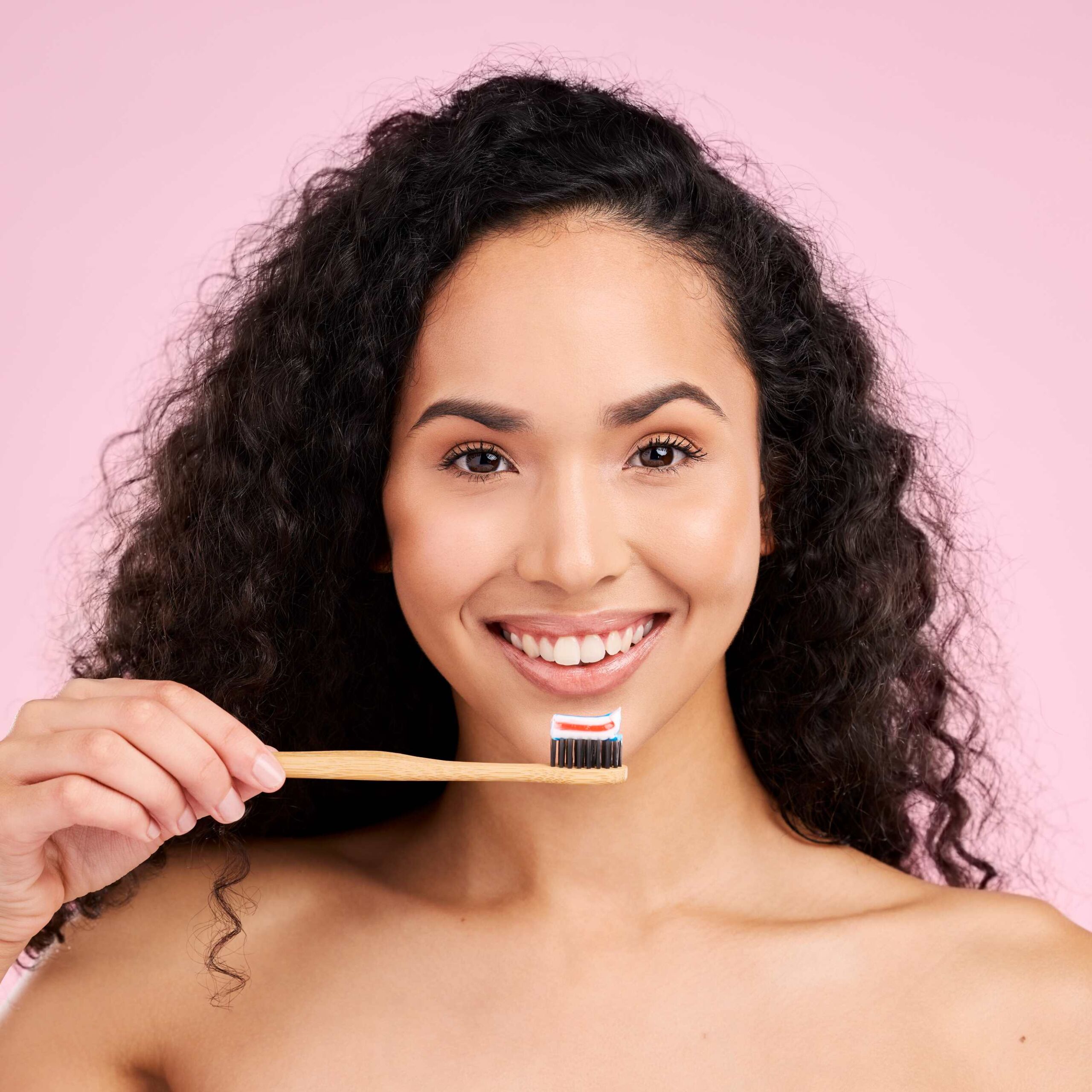 Happy woman holding a toothbrush