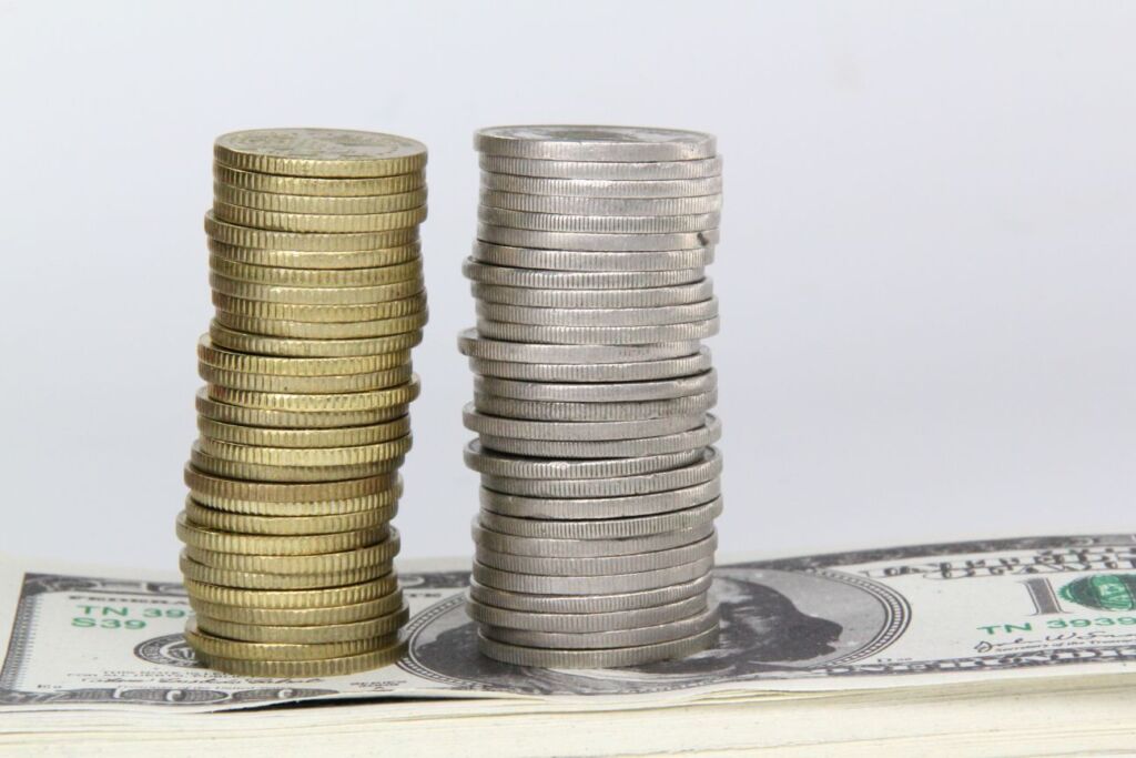 Coins and cash representing hair transplant pricing and package costs