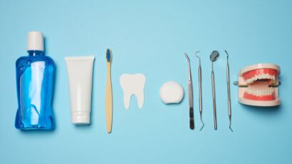 Oral hygiene tools and teeth model representing poor oral health prevention