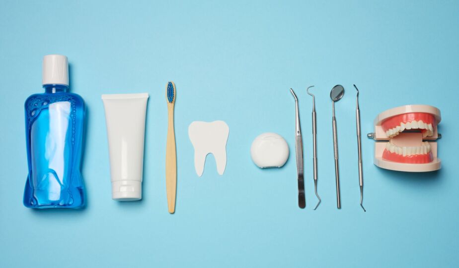 Oral hygiene tools and teeth model representing poor oral health prevention